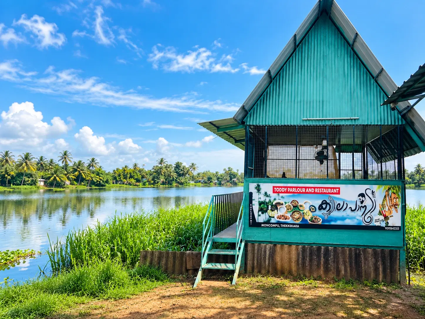 Our green lakeside hut on the backwater at Moncompu